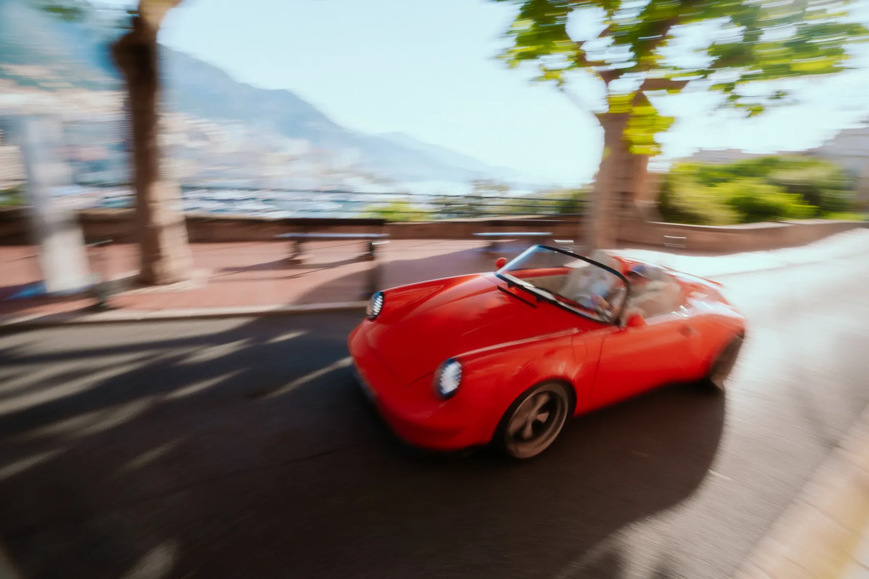 The Funkster in motion on a coastal road above the sea
